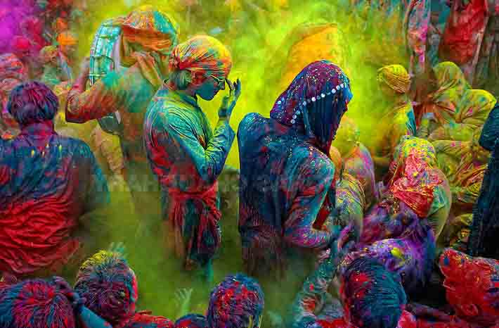 The festival of Holi is a religious festival. People sing bhajans of Radha and Lord Krishna on this day and it marks the beginning of Spring Season in india. Here you can see a gathering of people singing folk songs during Holi (Festival of Colors), India…